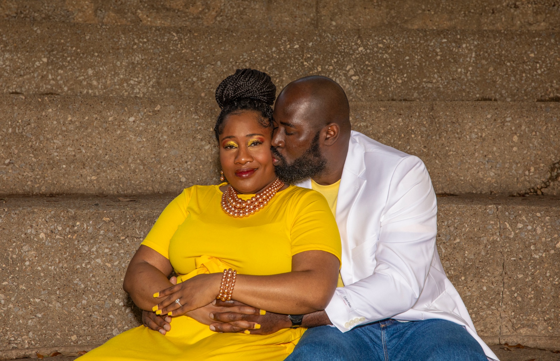 Boris kissing Marion on the cheek as she rests in his arms